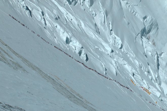 Part of a line of hundreds of climbers make their way up Mount Everest. (Guardian photo)