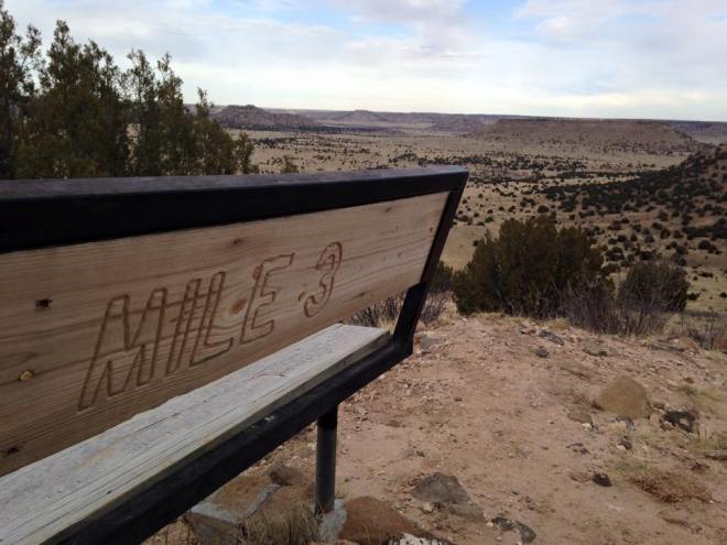 Mile marker benches are placed along the trail up Black Mesa. This one has a pretty nice view.